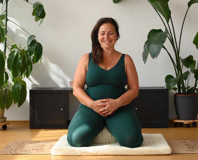 meditation in green jumpsuit amazonia